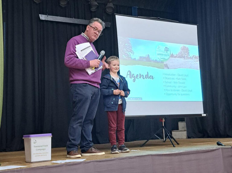 Trustee David Lloyd and Ethan, age 6 at the fundraising meeting.
